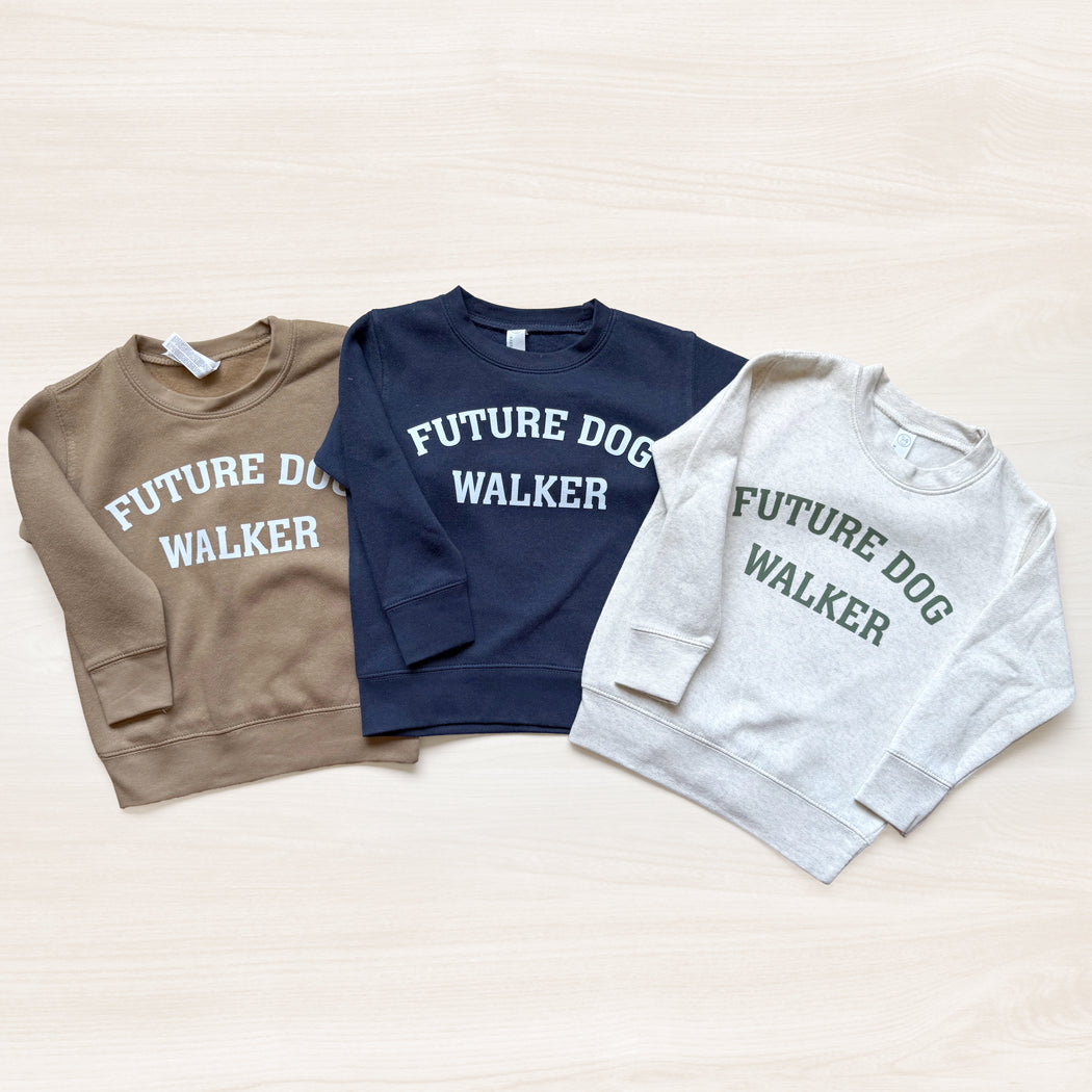 Three sweatshirts with 'Future Dog Walker' text on a light background