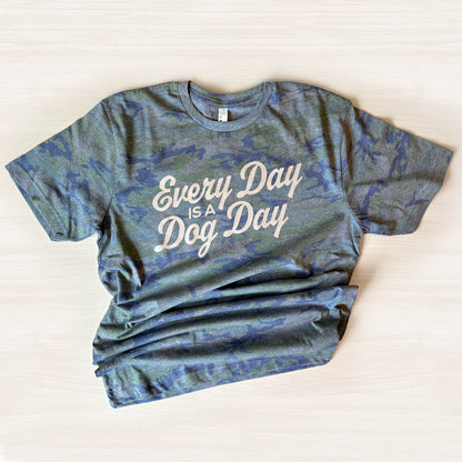 Blue camouflage t-shirt with 'Every Day is a Dog Day' text on a light background