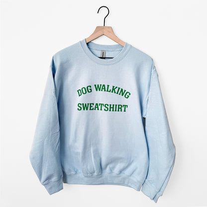 Light blue sweatshirt with 'DOG WALKING SWEATSHIRT' text in green on a white background