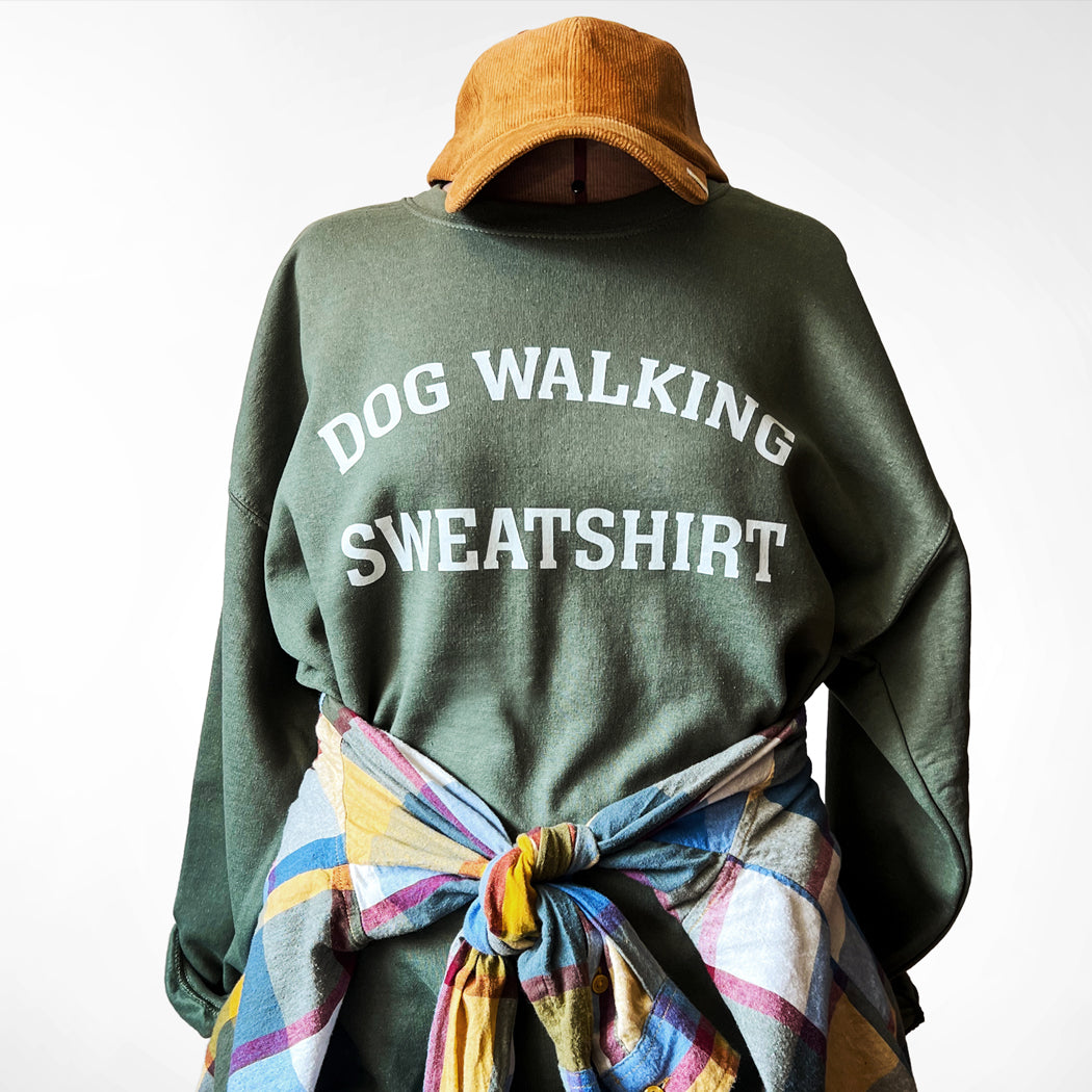 Front view of unisex army green Dog Walking Sweatshirt with white text.