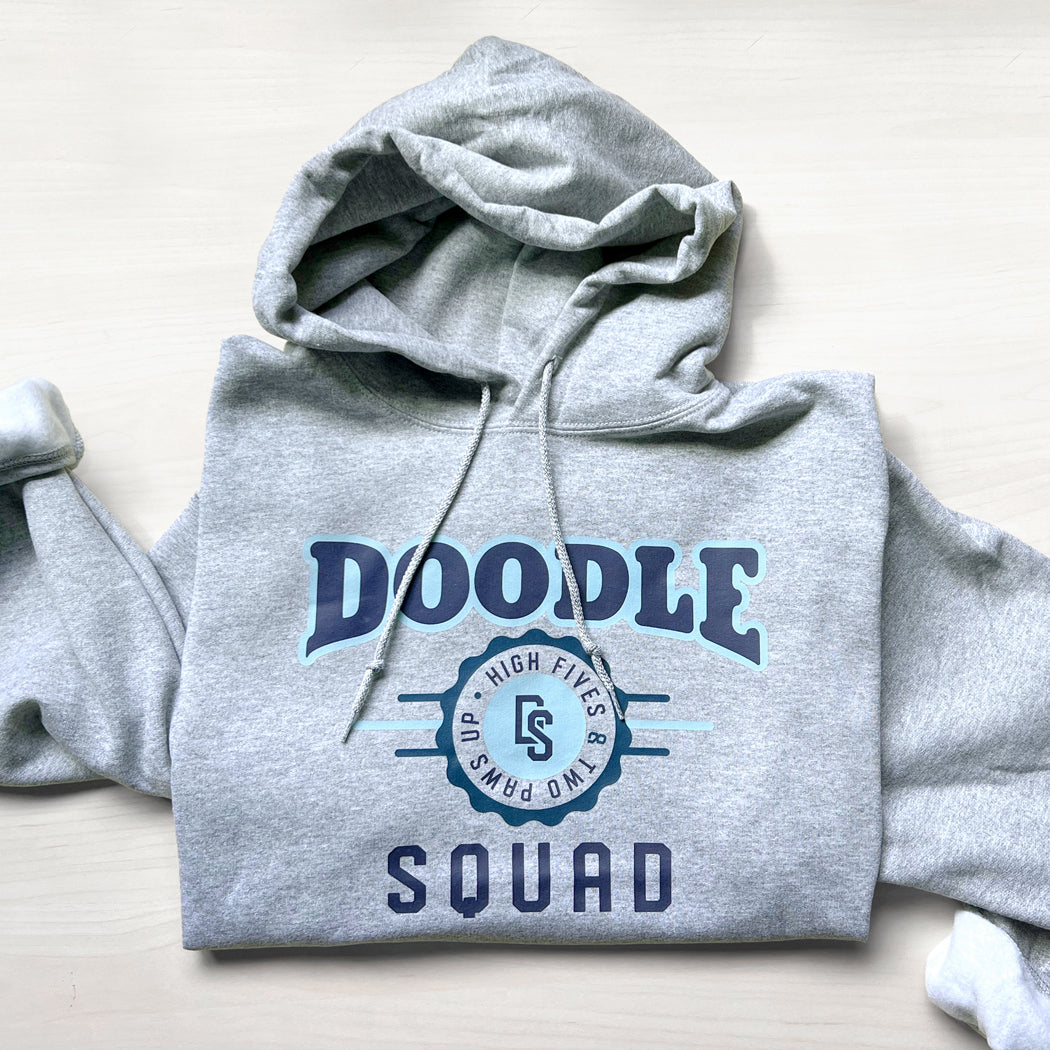 Soft fleece-lined hoodie with an athletic-style doodle dog design.